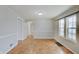 Dining area featuring wainscoting, wood floors and plenty of natural light at 4337 English Ave, Indianapolis, IN 46201