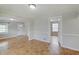 A light-filled living room featuring parquet floors and neutral-colored walls at 4337 English Ave, Indianapolis, IN 46201