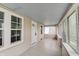 Bright sunroom with neutral decor, offering a calm and airy space at 4337 English Ave, Indianapolis, IN 46201