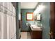 Stylish bathroom with dual vanity, granite counters, and tasteful modern fixtures at 4450 N St Rd 39, Danville, IN 46122