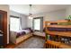 Cozy bedroom featuring a wooden bunk bed, soft carpet, and ample natural light at 4450 N St Rd 39, Danville, IN 46122