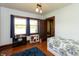 Bright bedroom with hardwood floors and bright natural light from large windows at 4450 N St Rd 39, Danville, IN 46122