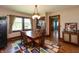 Charming dining room with a classic wood table, chairs and hardwood floors at 4450 N St Rd 39, Danville, IN 46122
