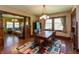 Inviting dining room featuring wood table, colorful rug, and adjacent sitting area at 4450 N St Rd 39, Danville, IN 46122