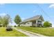 Charming single-story home with well-maintained lawn and gravel driveway under a blue sky at 4450 N St Rd 39, Danville, IN 46122
