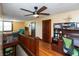 Spacious hallway with hardwood floors, ceiling fan and desk with a chair at 4450 N St Rd 39, Danville, IN 46122