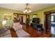 Bright living room with hardwood floors, comfortable seating, and view into other rooms at 4450 N St Rd 39, Danville, IN 46122