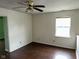 Bedroom features a ceiling fan, one window for natural light, and hardwood flooring at 4456 Redcliff N Ln, Plainfield, IN 46168