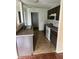 Functional kitchen featuring laminate countertops, white appliances, and dark cabinetry at 4456 Redcliff N Ln, Plainfield, IN 46168