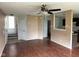 Spacious living room featuring wood floors, an open layout, and access to the kitchen and stairway at 4456 Redcliff N Ln, Plainfield, IN 46168