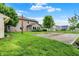 Large backyard featuring a basketball court, shed and landscaped yard at 4506 Tarragon Dr, Indianapolis, IN 46237