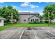 Spacious backyard with grass, trees, basketball court and view of house at 4506 Tarragon Dr, Indianapolis, IN 46237