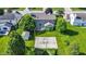 Aerial of a spacious backyard with a basketball court and mature trees, perfect for outdoor activities and relaxation at 4506 Tarragon Dr, Indianapolis, IN 46237