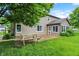 Large backyard with patio, picnic table, grass and view of home at 4506 Tarragon Dr, Indianapolis, IN 46237