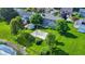 Aerial of a large backyard featuring a basketball court, a shed, and mature trees, offering plenty of space at 4506 Tarragon Dr, Indianapolis, IN 46237