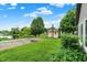 Spacious backyard with a basketball court, shed, and lush green lawn, adjacent to the house at 4506 Tarragon Dr, Indianapolis, IN 46237