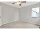 Bedroom featuring neutral carpet, ceiling fan and a fresh coat of paint at 4506 Tarragon Dr, Indianapolis, IN 46237