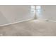 Neutral carpeted bedroom with natural light from the double windows at 4506 Tarragon Dr, Indianapolis, IN 46237