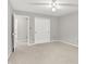 Spacious bedroom with neutral color palette, closet and access to additional rooms at 4506 Tarragon Dr, Indianapolis, IN 46237