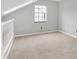 Bedroom with neutral carpeting, a window, and light gray walls at 4506 Tarragon Dr, Indianapolis, IN 46237