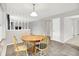 Cozy dining area with tile floors, a wooden table, and a view to the living room at 4506 Tarragon Dr, Indianapolis, IN 46237