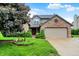 Charming two-story home with a brick accent, tidy lawn, and attached two car garage at 4506 Tarragon Dr, Indianapolis, IN 46237