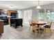 Eat-in kitchen featuring granite countertops, an island, tile flooring, and stainless steel appliances at 4506 Tarragon Dr, Indianapolis, IN 46237