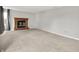 Spacious living room with a fireplace and neutral carpet, providing a welcoming and comfortable atmosphere at 4506 Tarragon Dr, Indianapolis, IN 46237