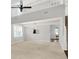 Open-concept living room featuring high ceilings, a ceiling fan, and a view to the dining room at 4506 Tarragon Dr, Indianapolis, IN 46237