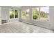 Sunroom featuring tile flooring and large windows, providing ample natural light at 4506 Tarragon Dr, Indianapolis, IN 46237