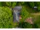 Aerial view of the property showcasing its lush greenery, spacious yard, and classic architecture at 5160 N High School Rd, Indianapolis, IN 46254