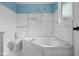 Bathroom with soaking tub and tiled walls at 5160 N High School Rd, Indianapolis, IN 46254