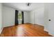 Bedroom features hardwood flooring and neutral walls at 5160 N High School Rd, Indianapolis, IN 46254