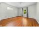 Comfortable bedroom with hardwood floors, natural light, and ample space for relaxation at 5160 N High School Rd, Indianapolis, IN 46254
