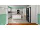 Spacious kitchen showcases modern appliances, white cabinetry, a wood-top island, and plenty of natural light at 5160 N High School Rd, Indianapolis, IN 46254
