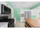Modern kitchen with stainless steel appliances, white cabinets, and a convenient center island at 5160 N High School Rd, Indianapolis, IN 46254