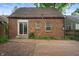 Brick backyard with sliding glass door to the house at 521 Kessler Blvd E Dr, Indianapolis, IN 46220