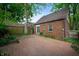 Spacious brick patio and backyard with lush greenery and mature trees at 521 Kessler Blvd E Dr, Indianapolis, IN 46220