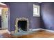 Vintage decorative fireplace with doorway featuring stained glass at 521 Kessler Blvd E Dr, Indianapolis, IN 46220