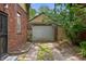 Spacious detached garage with private driveway and mature trees at 521 Kessler Blvd E Dr, Indianapolis, IN 46220