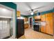 Traditional kitchen with wooden cabinets, updated appliances, and a connected dining area at 521 Kessler Blvd E Dr, Indianapolis, IN 46220