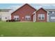 Backyard featuring a well-maintained lawn and an inviting patio area at 5304 Maywood Dr, Whitestown, IN 46075
