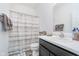Bathroom with a combined shower and tub, a sleek vanity, and neutral decor at 5304 Maywood Dr, Whitestown, IN 46075