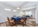 Bright dining area with vaulted ceiling, hardwood floors, and elegant decor at 5304 Maywood Dr, Whitestown, IN 46075