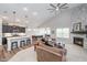 Spacious living room featuring a fireplace, open to the kitchen and dining area at 5304 Maywood Dr, Whitestown, IN 46075