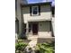 Townhouse exterior showcasing a well-kept front yard and a welcoming entrance at 6070 Southbay Dr, Indianapolis, IN 46250