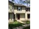 Inviting townhouse featuring neutral siding, dark shutters, and well-maintained landscaping at 6070 Southbay Dr, Indianapolis, IN 46250