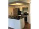 Modern kitchen with stainless steel appliances, dark countertops, and a functional layout at 6070 Southbay Dr, Indianapolis, IN 46250