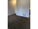 Spacious living room with neutral carpet and white walls, ready for personalized decor at 6070 Southbay Dr, Indianapolis, IN 46250