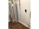 A water heater sits on a wood-look floor with white walls at 6070 Southbay Dr, Indianapolis, IN 46250